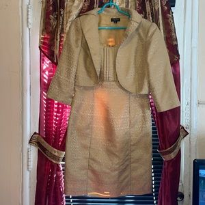 A Beautiful Gold dress with a short Gold Jacket . Slightly wear